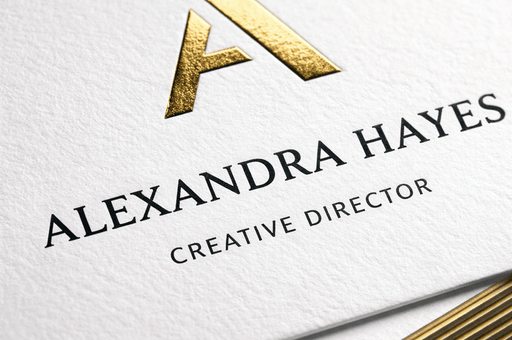 38pt white cotton letterpress business card featuring custom gold foil stamping and gold gilded edges for Alexandra Hayes