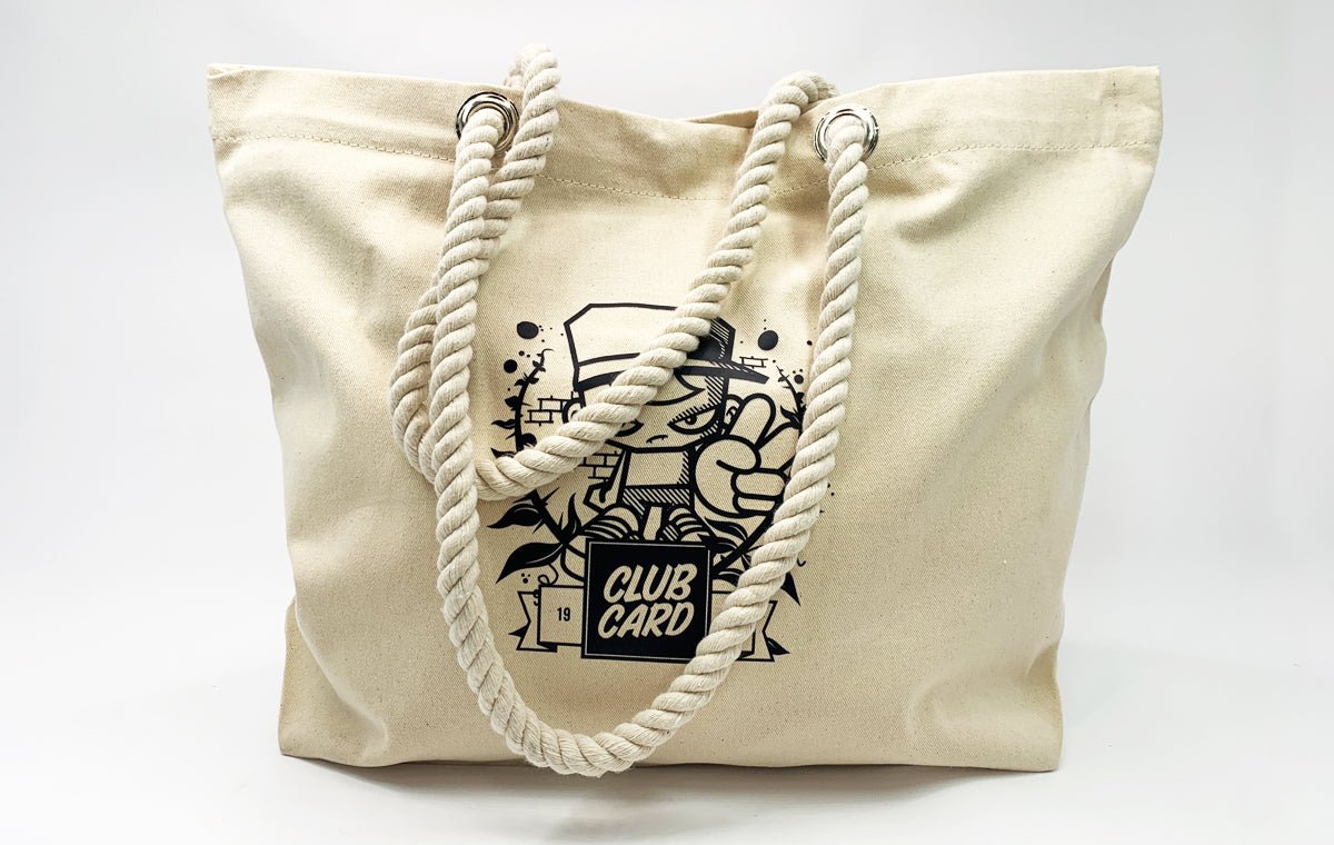 Natural canvas beach tote bag with thick rope handles custom printed with a black Clubcard mascot graphic