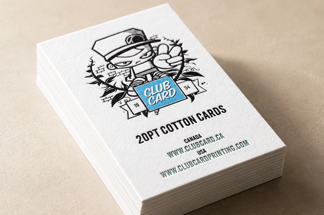 A stack of white letterpress cotton cards with a black line-art illustration and 'CLUB CARD' logo embossed on a filed of iridescent foil