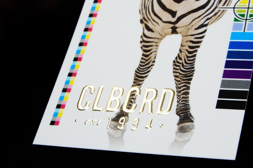 Close-up of Clubcard sample card on 19pt suede stock featuring CLUBCARD logo and text in raised gold foil