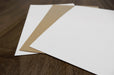 Coated and uncoated white with desert storm uncoated blank card stocks.