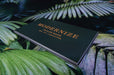 Photo of gold foil stamping on black background on 24pt smooth uncoated card stock | Business cards for Modernize Tailors | Clubcard Printing USA