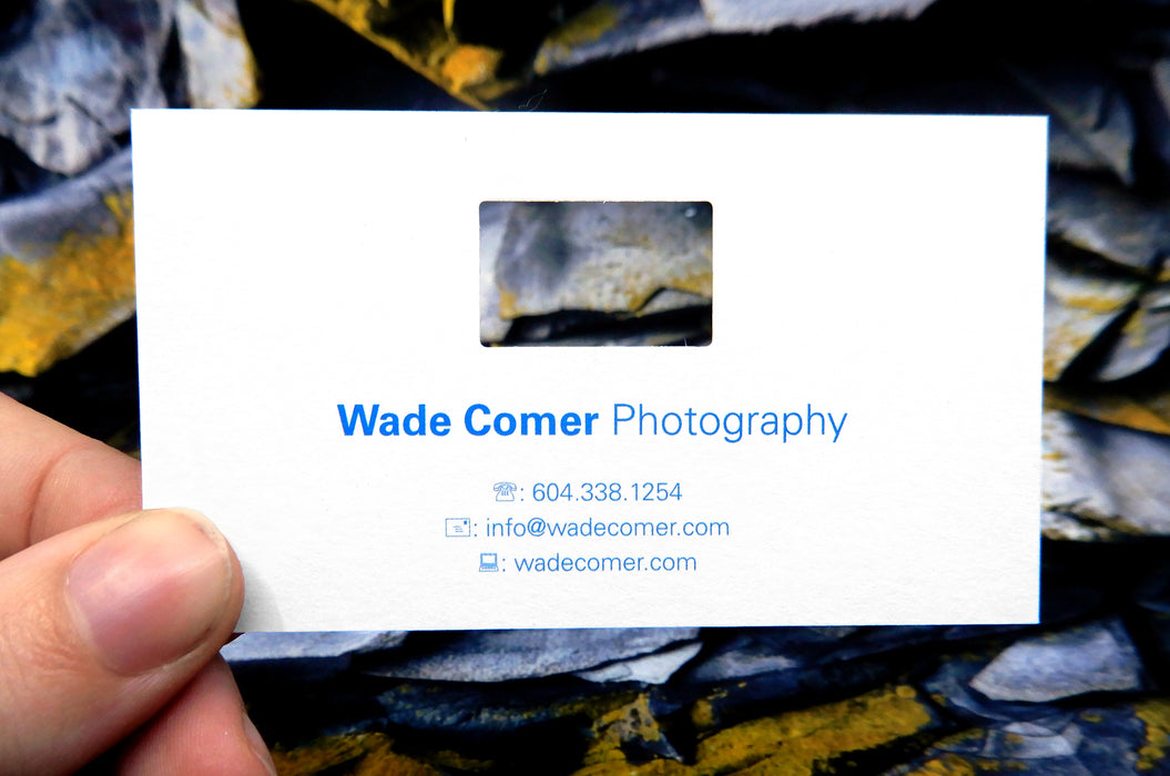 Custom business card for Wade Comer Photography | White background with blue text | Die cut rectangle above text center justified | Clubcard Printing USA