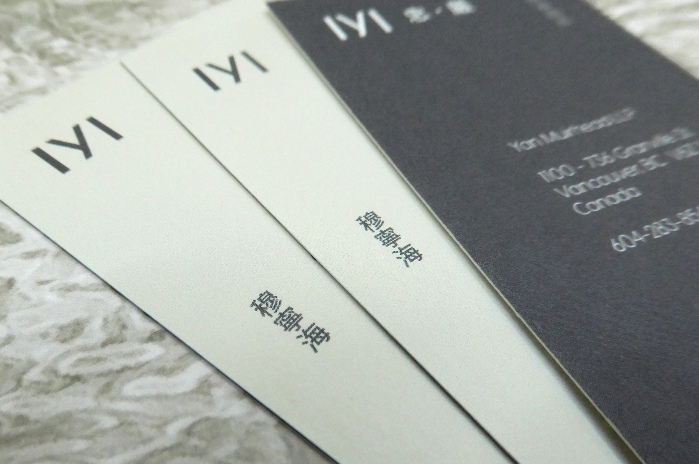 Close up of business cards for Yan Muirhead LLP on 16pt bamboo stock | Clubcard Printing USA