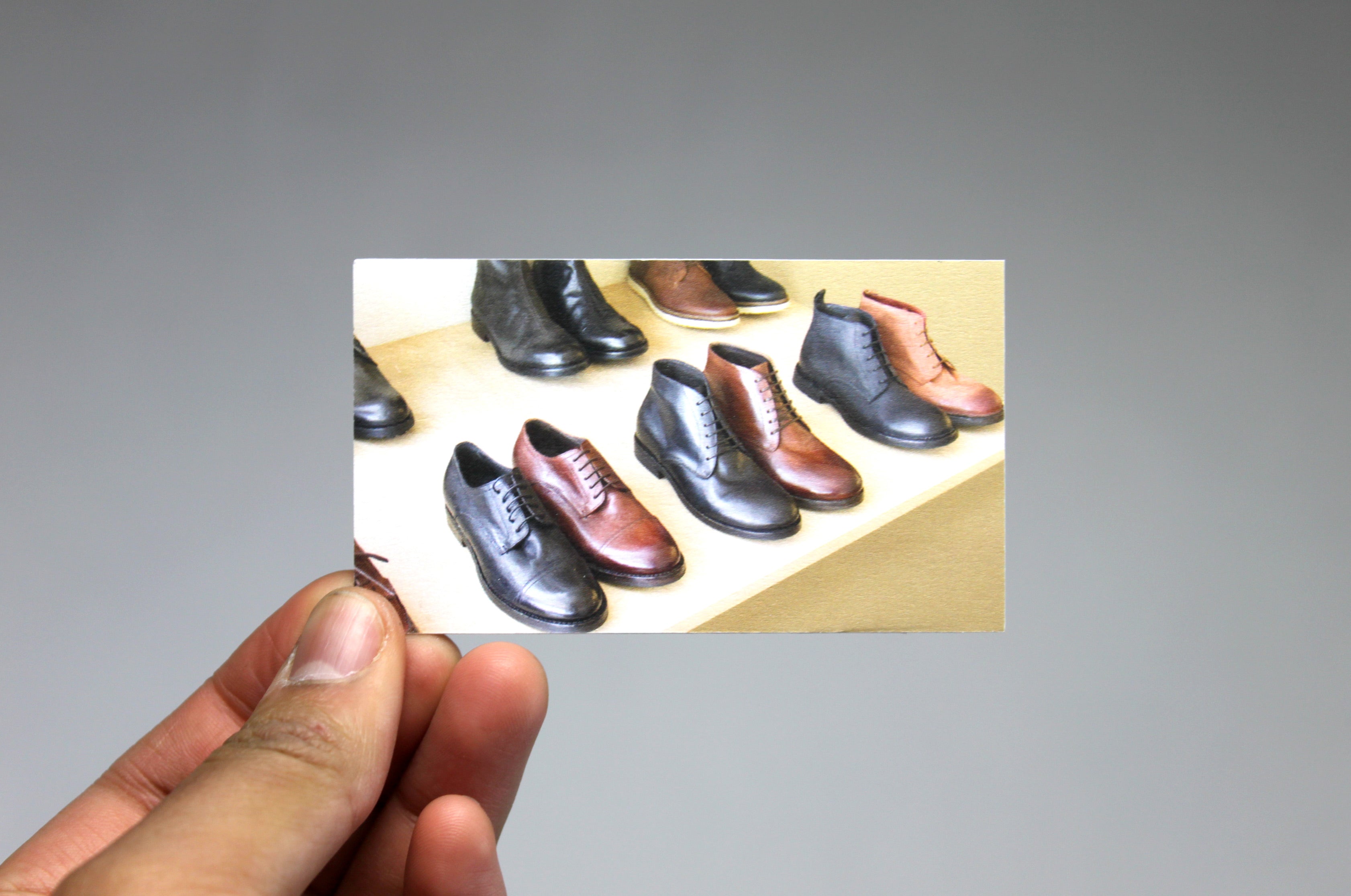 Business cards with leather shoes printed on 22pt uncoated card stock | Clubcard Printing USA